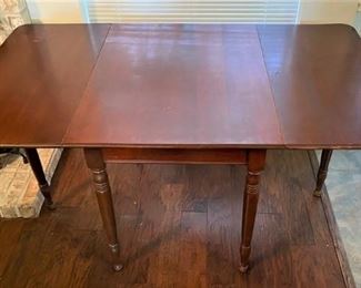 ANTIQUE 6-LEG DOUBLE DROP LEAF TABLE.