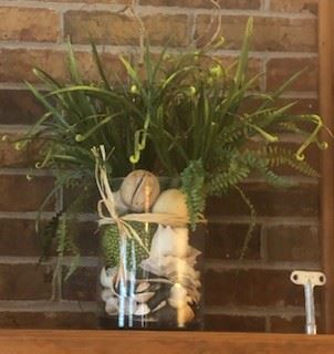 Glass vase with seashells, decor, artificial plant, fancy straw bow