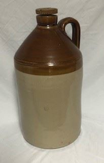 Large ceramic hand made and hand painted corked top jug. About 3' H. 
