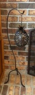 Pineapple candle holder, wrought iron . Pineapple has little door that opens to place candle - candle included. 