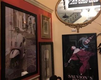Wall art: Sauvion's Brandy ad poster, $219 and Large gold oval mirror, $329