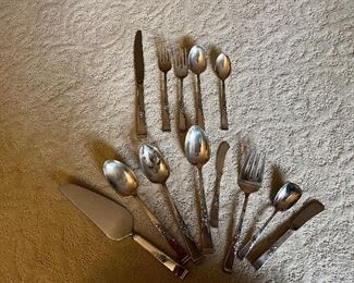 12 five piece placesettings of Reed and Barton's "classic Rose" sterling flatware including 8 serving pieces. 