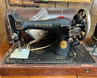 Vintage portable Singer with domed wood lid