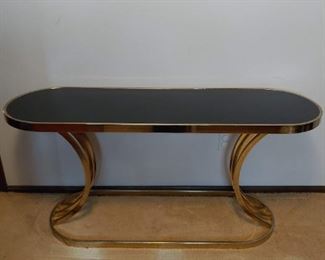 brass and black glass console