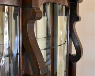 Beautiful lion foot display cabinet with curved glass panes. (detail)
