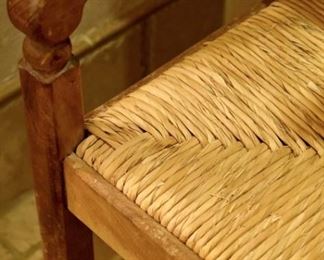 Wood loveseat bench with woven seats. (detail)