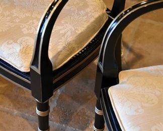 Lacquered and gilt chairs with custom cushions atop caned seats. (detail)