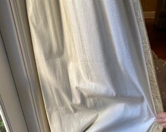 Lining of drapes multiple sets in living area.