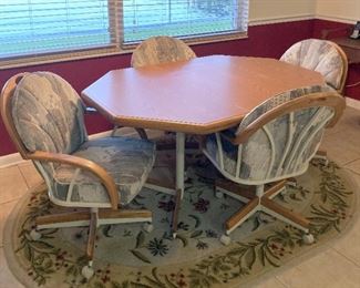 TABLE AND 4 ROLLING CHAIRS
