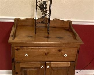 MODERN REPRODUCTION OF AN ANTIQUE "DRY SINK" CABINET. SOLID PINE WOOD. PORCELAIN DOOR AND DRAWER PULLS. WINE RACK SITTING ON TOP