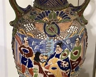 GORGEOUS ORIENTAL VASE. AGE AND MAKER UNKNOWN. BASE-RELIEF ORNAMENTATION ALL OVER. TRADITIONAL SCENE.  SIDE #1.