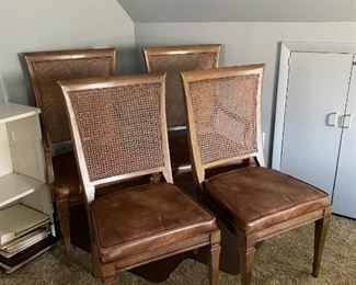 $500  - Set of 4 Cane Back Chairs - 2 Side Chairs and 2 Arm Chairs w/Faux Leather Seats
LOCATION:  WASHINGTON DC
WHY WE LOVE IT:
Mid-Century Modern style dining chairs with light caramel colored high quality faux leather upholstered seats. Sculptural legs, sturdy. Frames are in good original condition with a slight speckled finish, typical of Mid Century pieces. Very stylish!
DETAILS + DIMENSIONS:
2 Side Chairs: 17W x 17D x 38H inches 
2 Arm Chairs:  23W x 19D x 40H inches
Seat Height:  19 inches
CONDITION: These chairs have been well cared for and are in good condition. They show minor superficial signs of wear to be expected with use and age.  Please refer to photos for a more detailed look at condition.  We make every attempt to list and photograph any defects or signs of wear that are significant to this sale. 
LOCAL PICK UP.   BUYER IS RESPONSIBLE FOR ANY NECESSARY DISASSEMBLY AND ALL COSTS ASSOCIATED WITH SHIPPING OR PICK UP.  PLEASE CONTACT US FOR SHIPPING REFERRALS