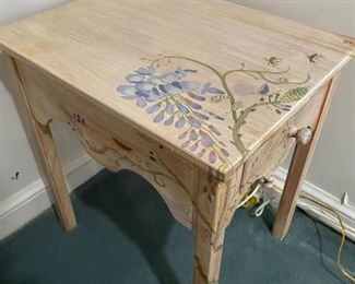$50 -  Hand Painted Floral Single Drawer Side Table

LOCATION:  WASHINGTON DC

WHY WE LOVE IT:

Sweet whimsical table that is perfect for a child's room, screened porch or bathroom.  The table is in very good condition.  Solid with very little signs of wear. 

DETAILS + DIMENSIONS:
21.5 x 16.5 x 23.5H in

CONDITION: Vintage piece in very good condition with little signs of wear.  Please refer to photos for a more detailed look at condition.  We make every attempt to list and photograph any defects or signs of wear that are significant to this sale. 

LOCAL PICK UP.   BUYER IS RESPONSIBLE FOR ANY NECESSARY DISASSEMBLY AND ALL COSTS ASSOCIATED WITH SHIPPING OR PICK UP.  PLEASE CONTACT US FOR SHIPPING REFERRALS