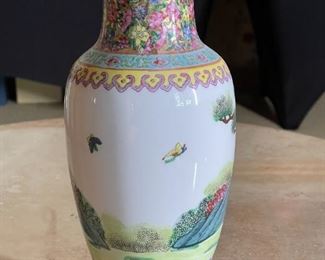 Handpainted Chinese vase	10. 25 inches tall 4.5 inches wide	
