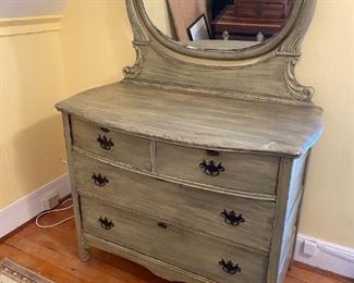 Beautiful bow front dresser has a unique harp on  beveled mirror