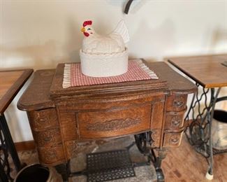 . . . . a nice early 1900's oak sewing machine with chicken adorning