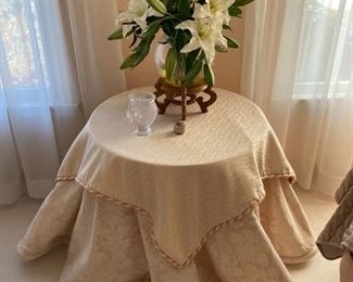 Side table, linens, floral arrangements