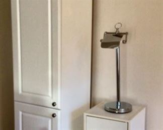 Tall White Cabinet and Small White Cabinet and a Toilet Tissue Holder