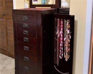Jewelry armoire opens on both sides