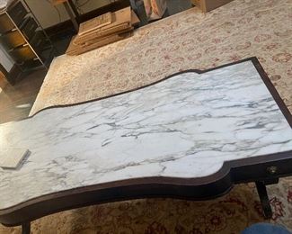 Marble topped coffee table with Lion / Griffen pulls 17" tall x 55" long x 24" deep $325