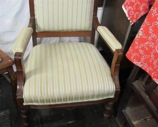 oak arm chair. silver, gold, and white striped