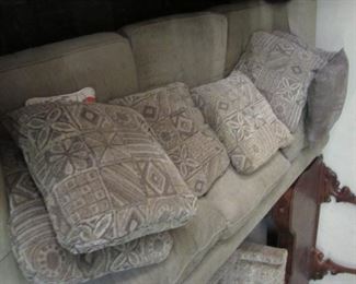 tan sofa with tan and dark brown sofa cushions