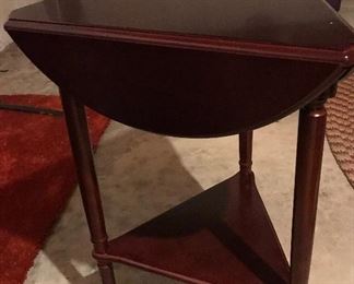 Triangular shaped cherry wood side table