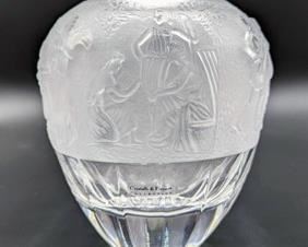 Cristalli di Firenze Crystal Vase. A lovely vase with Greek/Roman designs. Is reminiscent of a Lalique Vase. This vase was made in Italy several years ago from quality crystal! The greek designs are simply stunning! This vase orgially retailed for $600.00 several years ago.  

Looks to be in excellent condition and measures 8” high and 6” in diameter at the top.