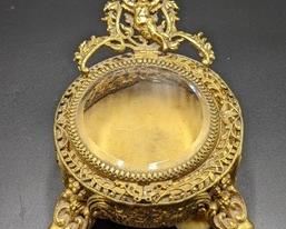 Vintage Gold Tone Cherub Trinket Box. There is some light paint wear that can be seen in the photos. Measures 4” in diameter and 2” high.
