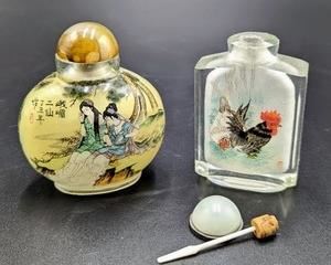 Pair of Chinese Snuff Bottles. The top of one is loose and needs to be repaired/glued. The tallest measures 3” high and 3” wide.