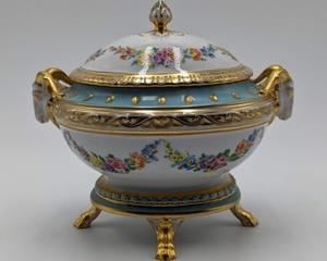 Dresden Covered Porcelain Dish with a footed base. Looks to be in excellent condition. Measures 8” wide and 7” high.