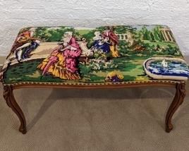 Needlepoint Bench with a lovely vintage scene. There are some light scratches on the wood, but in overall great shape!

Measures 35” x 16” and 19” high.