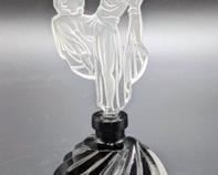 Czech Art Deco Perfume Bottle with gorgeous design! There is a small mark on the bust of the woman and unknown if removable. Measures 6.5” high and 3” in diameter at the base.