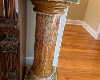 This is a plant stand very heavy made of granite and marble beautiful