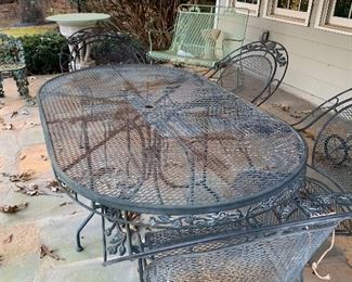 Another outdoor set with the glider table and four chairs and chase lounge we also have a smoker and additional wicker furniture as well for outside