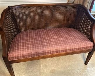 Cane back settee