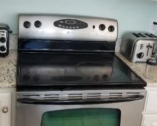 GE microwave oven mfg. 10/90; Maytag electric range