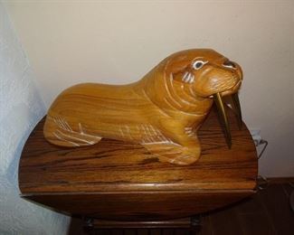 carved wood walrus with metal tusk