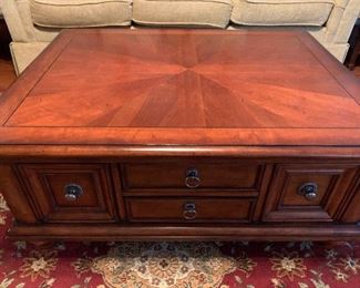 Coffee table with storage drawers