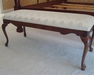 Master Bedroom-Upstairs:  The Queen Anne padded foot bench has neutral ivory color upholstery.  It measures 46" wide.