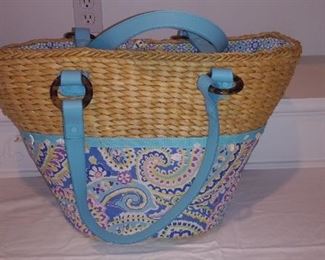 "Smalls" Area:  This VERA BRADLEY bag is part straw and fabric with blue straps.