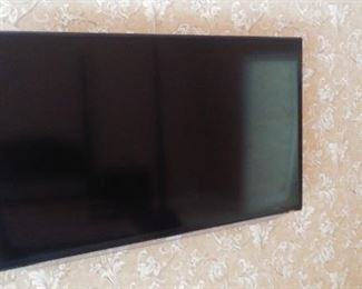 Master Bedroom-Upstairs:  A 40" SAMSUNG flat screen TV is wall mounted and for sale.  The price includes the wall  mount hardware.