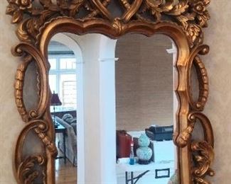 Foyer:  The elaborate gold frame mirror above the banded chest measures 29" wide x 47-1/2" tall.
