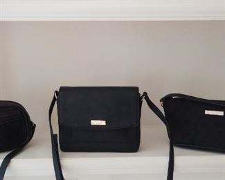 "Smalls" Area:  Three authentic designer purses are shown:  a dark navy canvas/leather cross-body GUCCI; a black cross-body KATE SPADE; and a black canvas/leather GUCCI handbag.