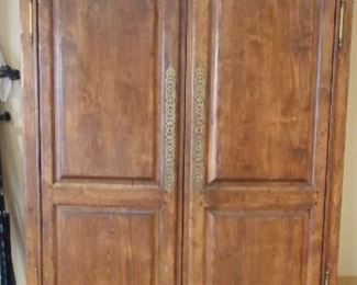Lower Level:  This armoire is great for storage!  It has two large doors over two shallow drawers and measures 53" wide x 35" deep x 88-l/2" tall.  It is believed to a be a knock-down cabinet.