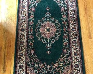 Foyer:   This small area rug in green, tan, and rose measures 3'  x  5'  6."