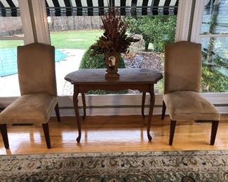 Kitchen Area:  A vintage scalloped side table with curved legs is flanked by two of six armless chairs.  Each of the chairs is separately priced---so buy as many as you need!
