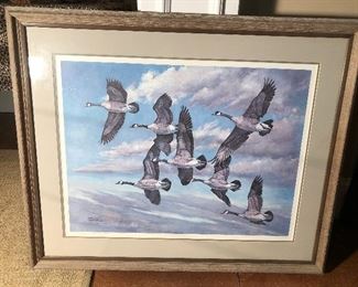 Lower Level:  This large (37" x 31") framed Canadian geese in flight print is signed and numbered by artist Charles Schwartz.