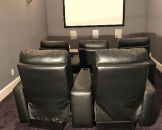 Lower Level-THEATER Room:  A set of five leather, reclining theater seats is for sale.  The front row has three chairs; the back row has two chairs.  (They were originally purchased at Amini's in Chesterfield.) An included  custom made wooden platform was made for the back row to raise them up several inches.  Closer photos follow.  (By the way the screen and electronics are NOT for sale.)