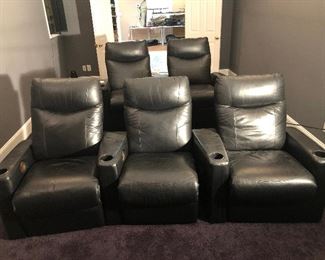 Lower Level-THEATER Room:  The first row has three black leather recliners with cup holders.  The back row has two black leather recliners with cup holders also.